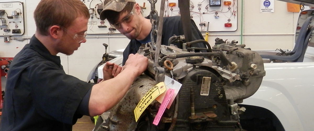 Students fixing motor