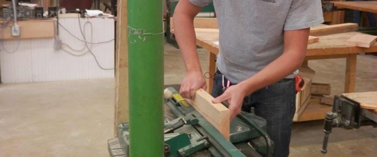 Student cutting wood