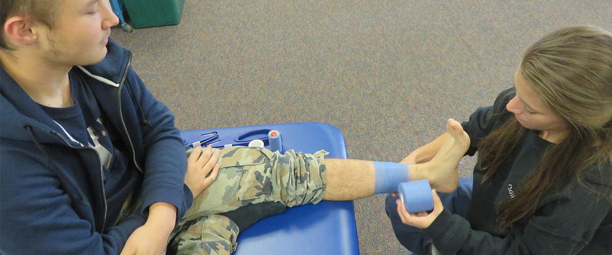 Student getting foot wrapped